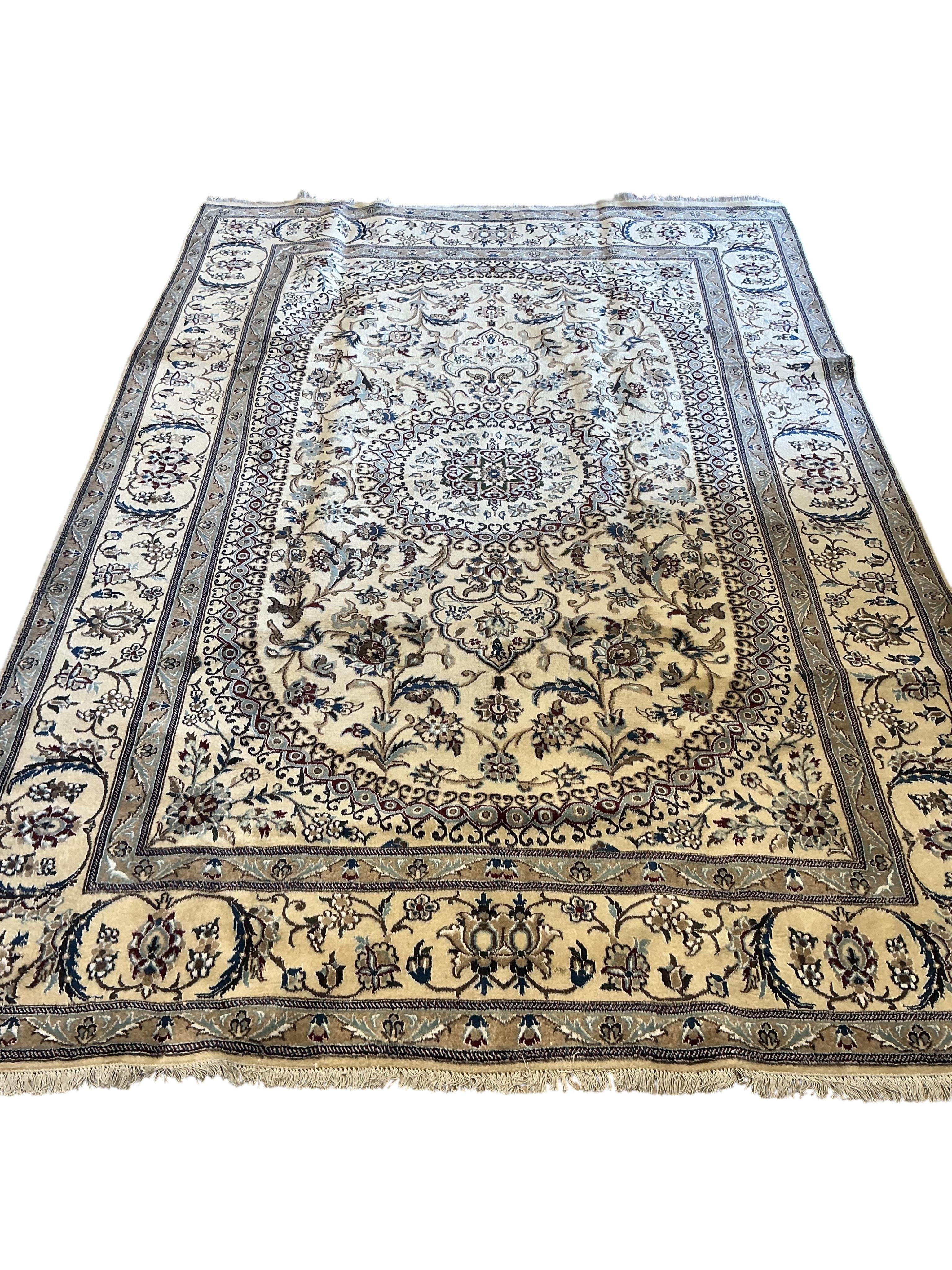 A Nain ivory ground carpet, 293 x 198cm